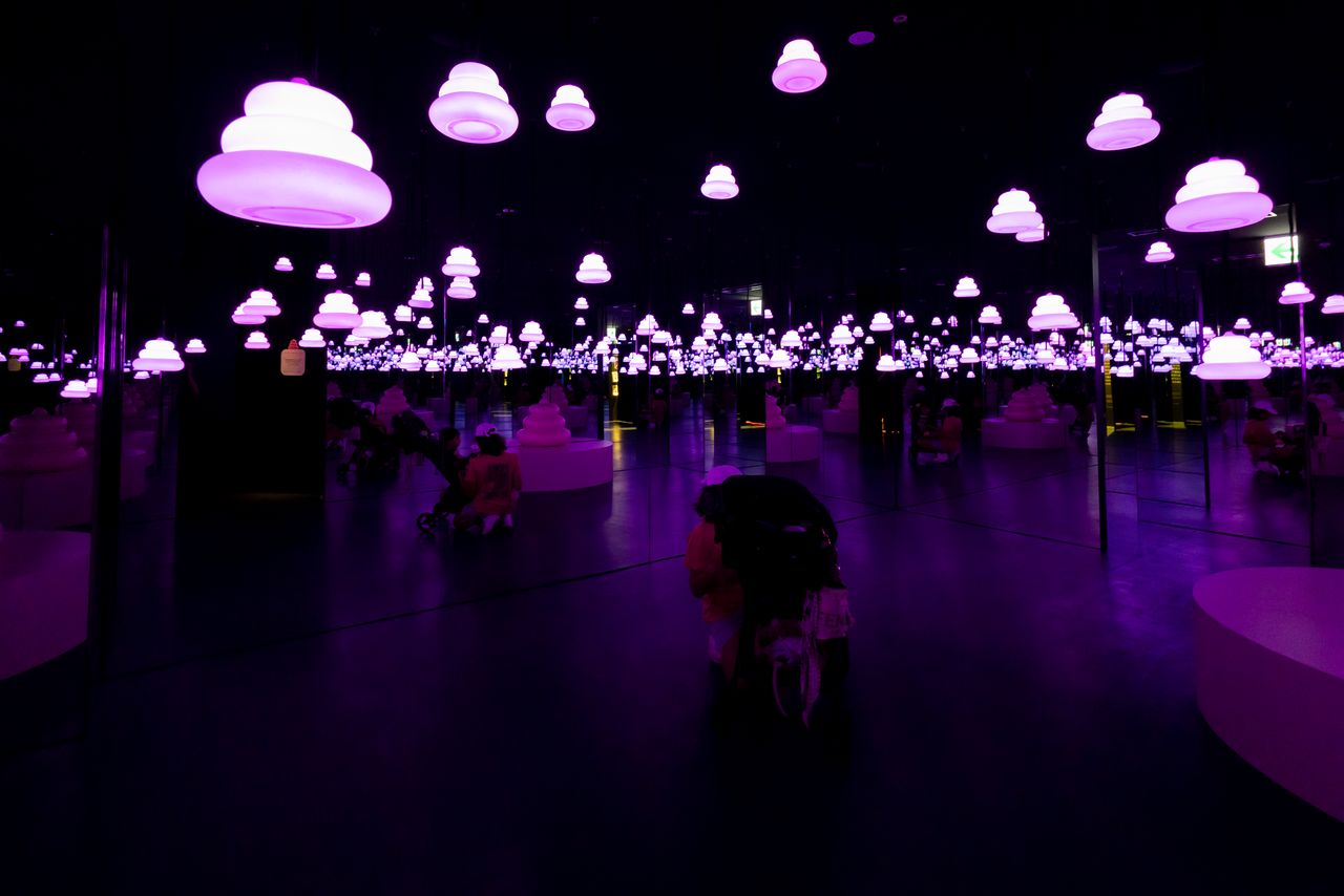 Countless glowing turds float through a mirrored room in the “Galaxy of Poop.” (© Nippon.com)