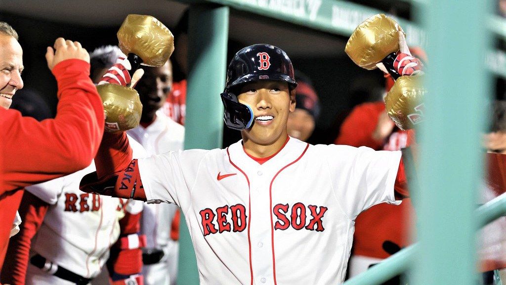 Masataka Yoshida of the Boston Red Sox walks back to the dugout