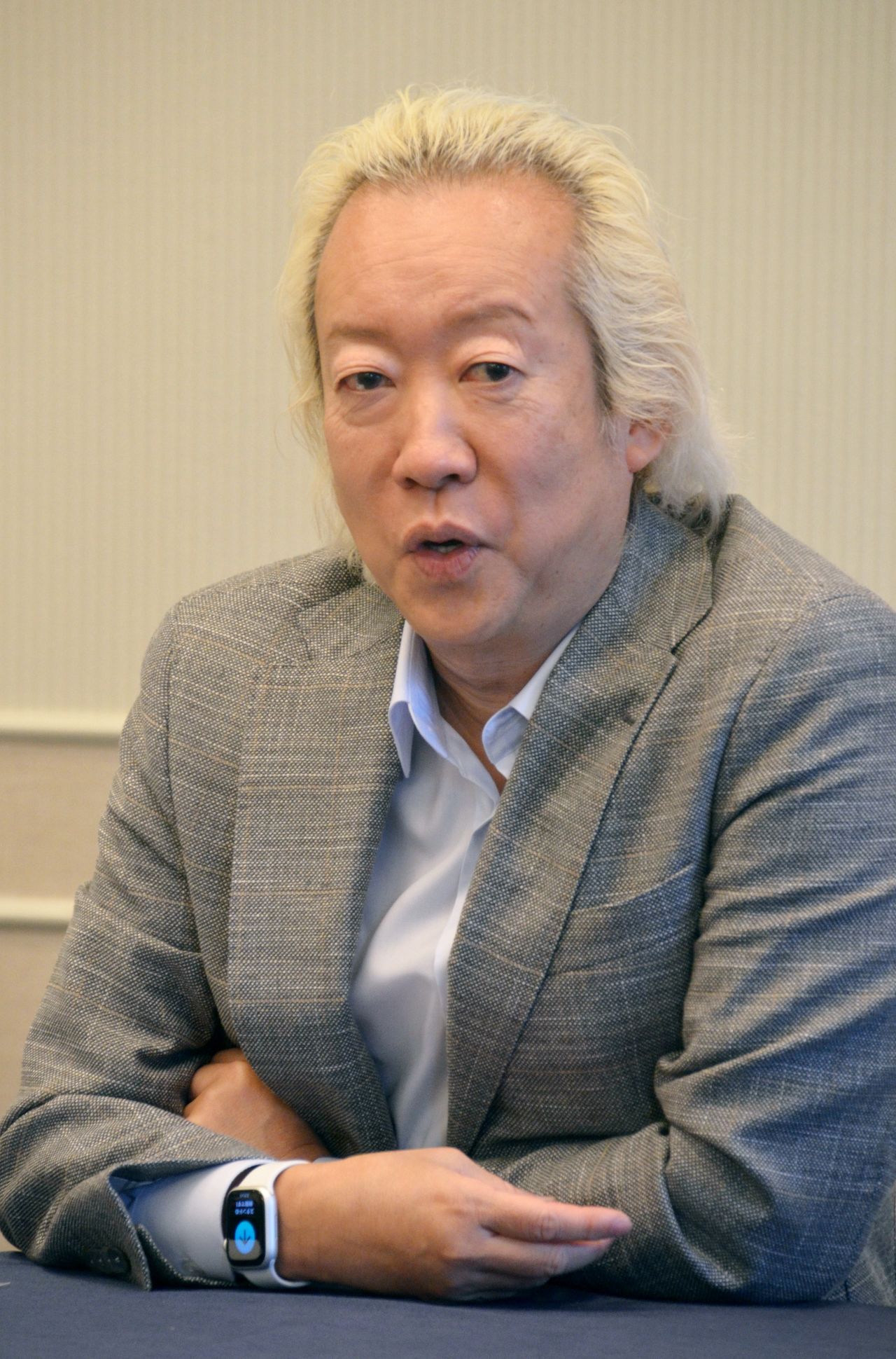 Starto Entertainment CEO Fukuda Atsushi speaking to journalists on December 9, 2023, in Minato, Tokyo. (© Jiji)
